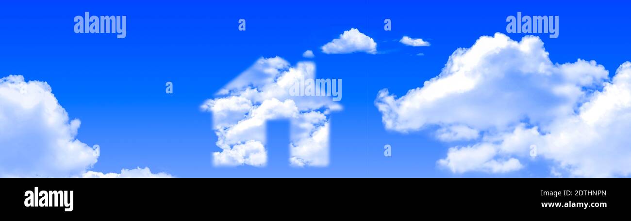 House shape in clouds concept on a bright blue sky day panoramic Stock Photo