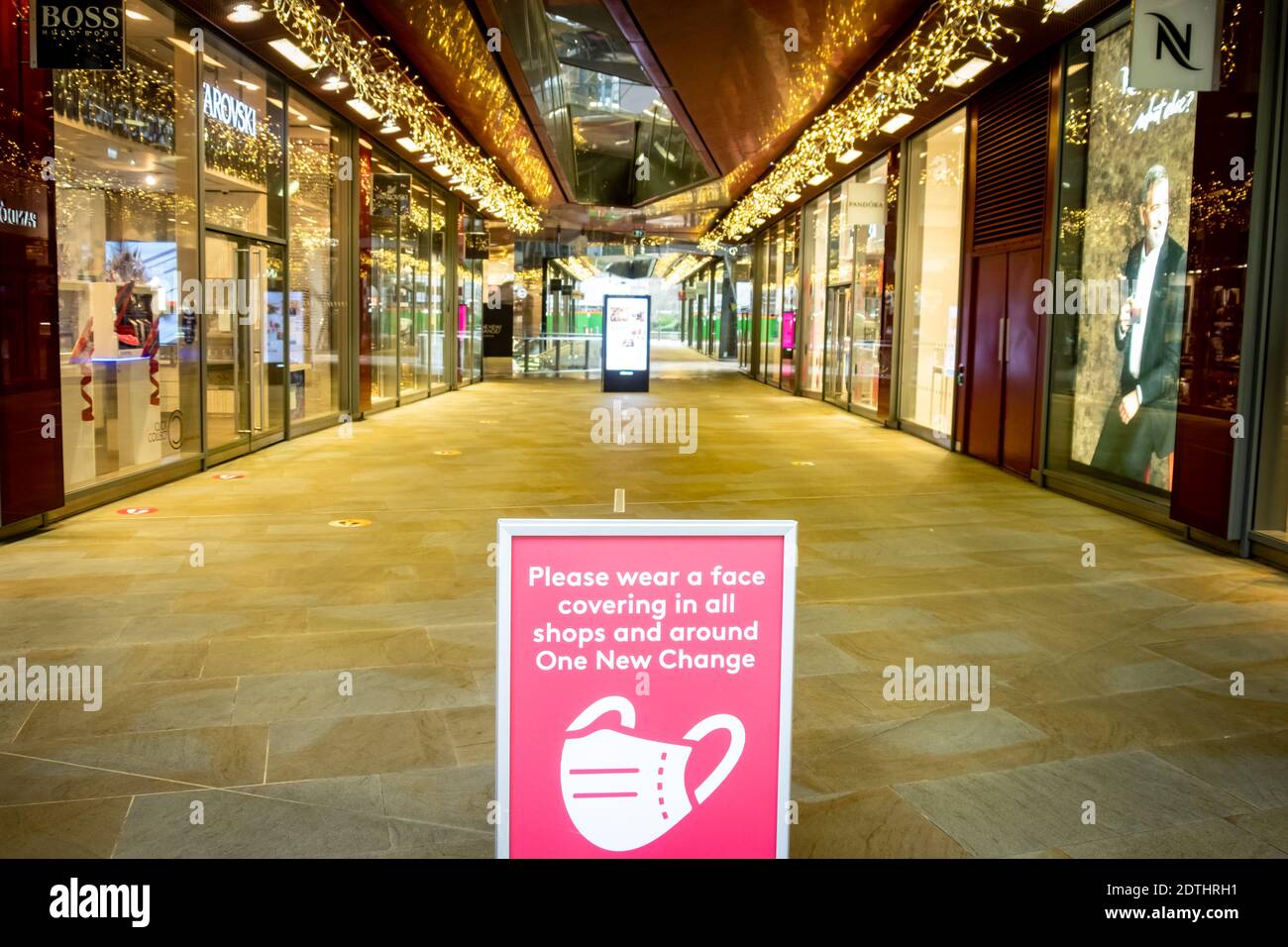 London- December 21, 2020:  Covid19 signage in empty New Change One shopping mall in central London a few days before Christmas in tier 4 lockdown Stock Photo