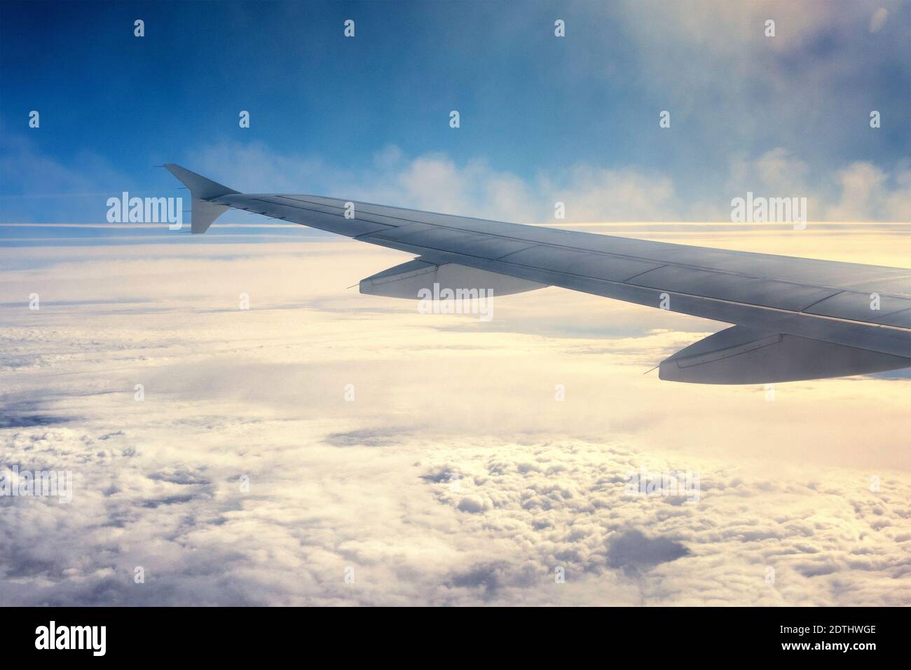 View above the clouds from the airplane window Stock Photo - Alamy