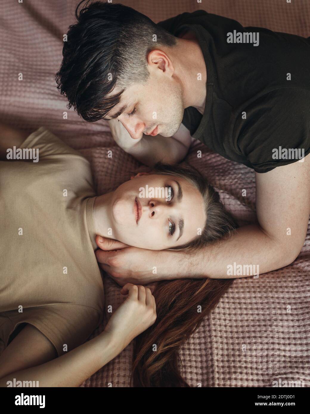 Couple lying in bed together hi-res stock photography and images - Alamy