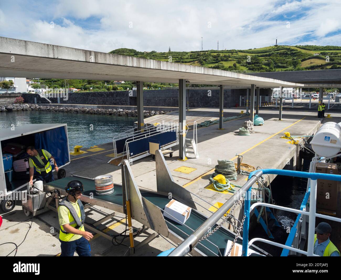Modern ferry terminal in the new harbour, loading of luggage. Horta