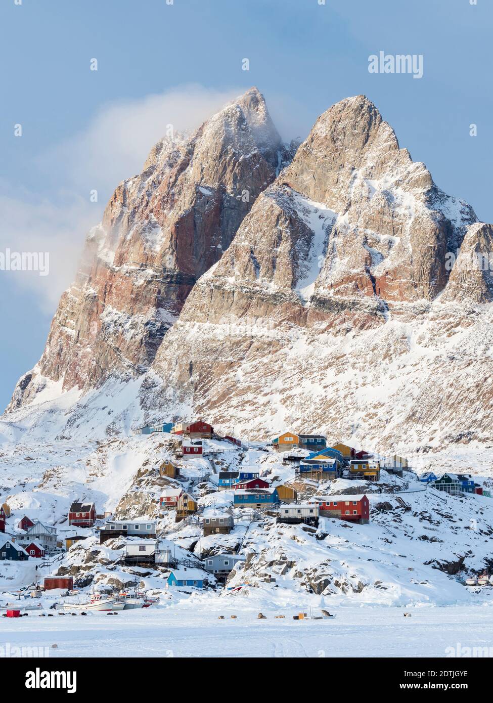 Town Uummannaq during winter in northern Greenland, seen from the frozen fjord. America, North America, Denmark, Greenland Stock Photo