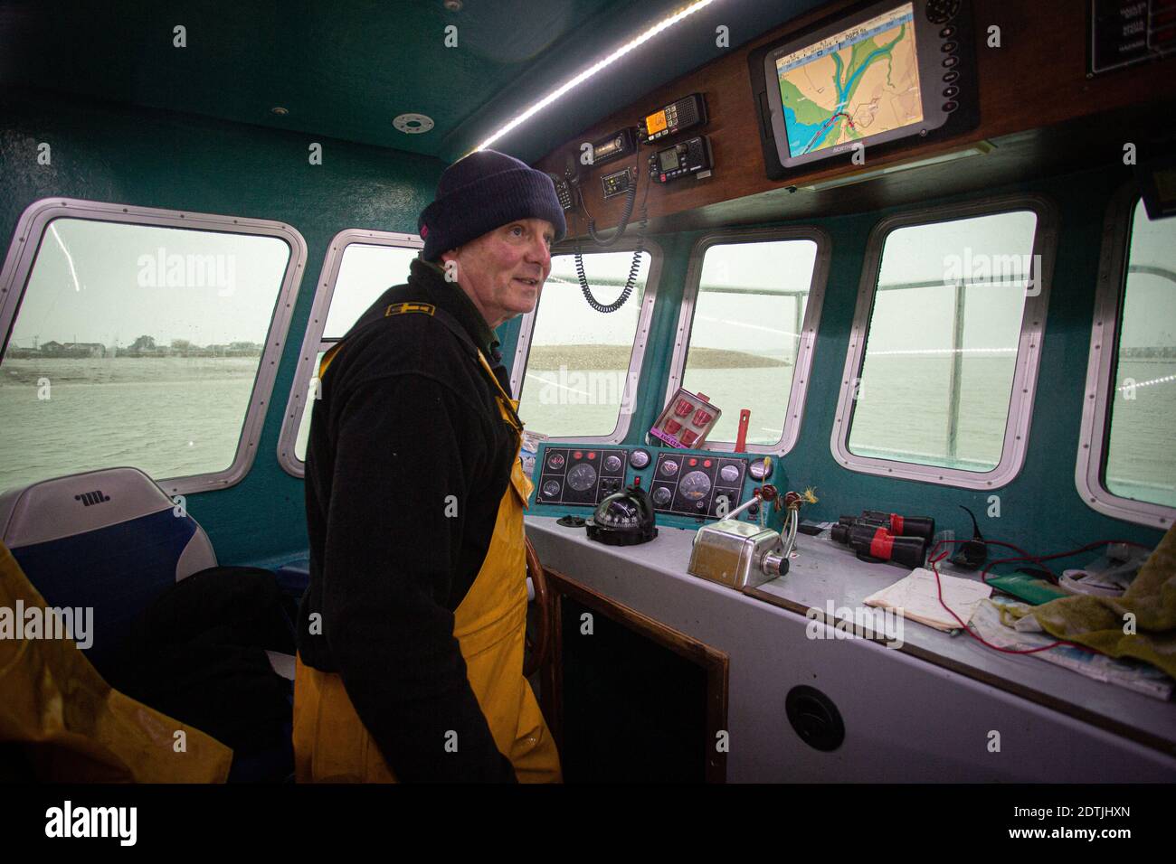 Great Britain / Essex/ Terry Stimpson in the bridge of the Sea Glory fishing off Brightlingsea in the North Sea. Stock Photo