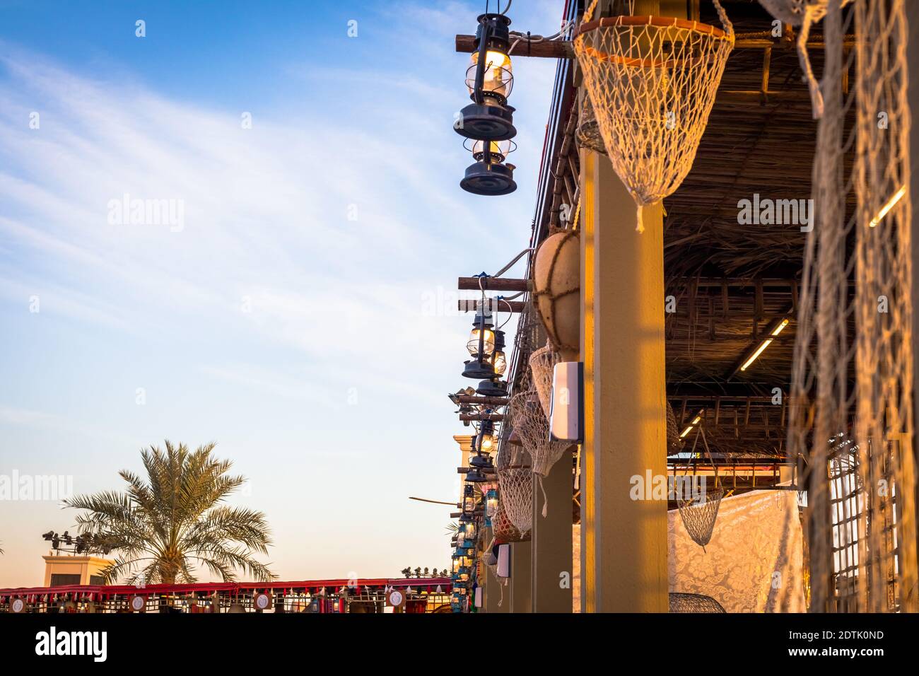 Arabic street lanterns hanging on wooden pole,View of Abu Dhabi, United