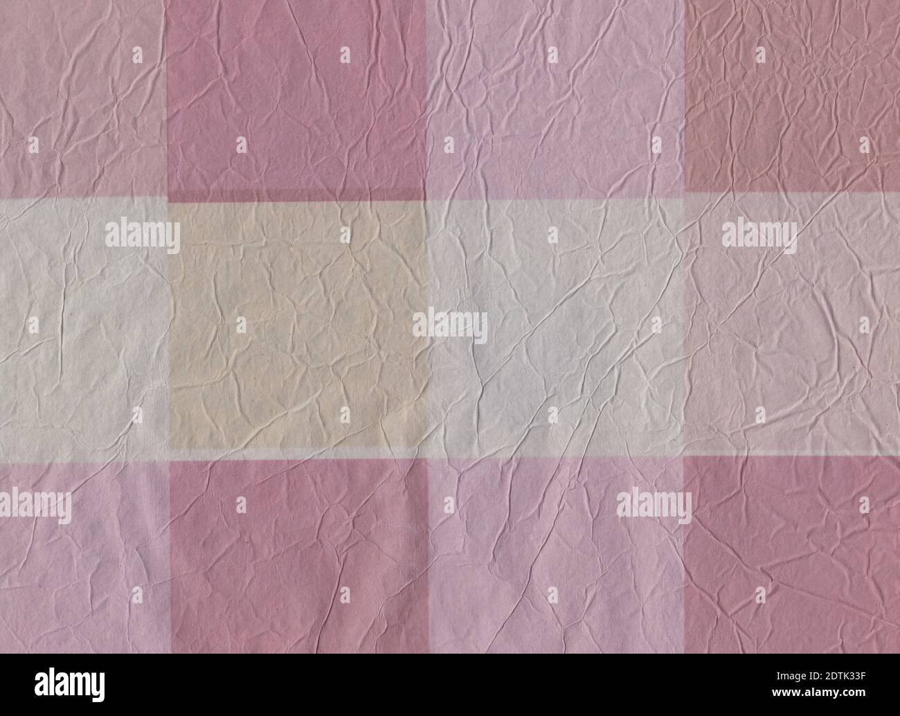 Pink colored crumpled wrapping paper. Checkered. Wrinkled. Creased