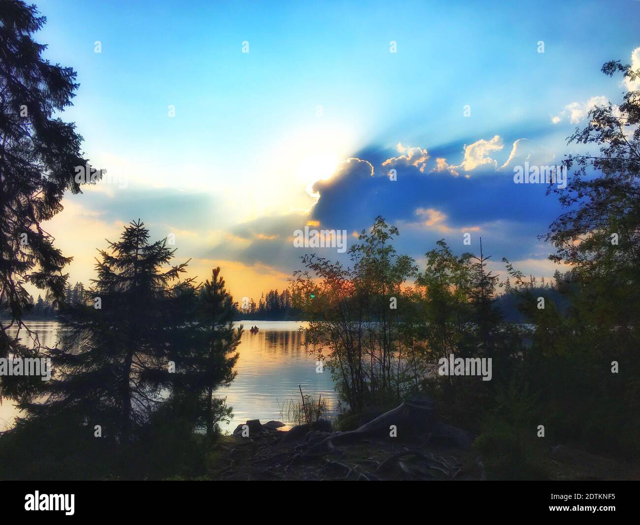 Scenic View Of Lake Against Sky During Sunset Stock Photo