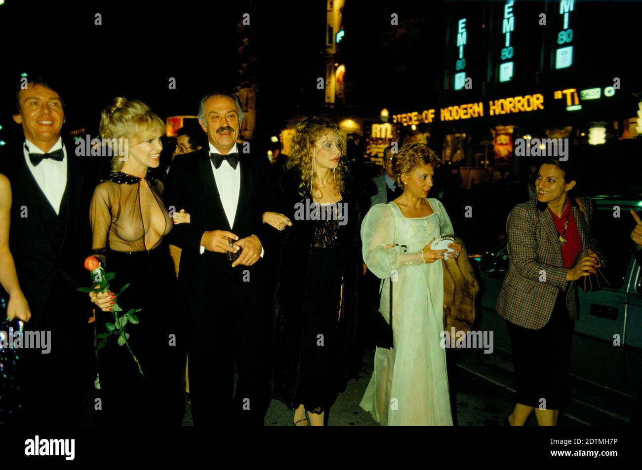 Jacques Medecin former Mayor of Nice South of France after a premier Cannes Film festival woman on his right arm with red rose is  Bobbie Bresee an American film actress and starlet. Cannes France 1980 HOMER SYKES Stock Photo