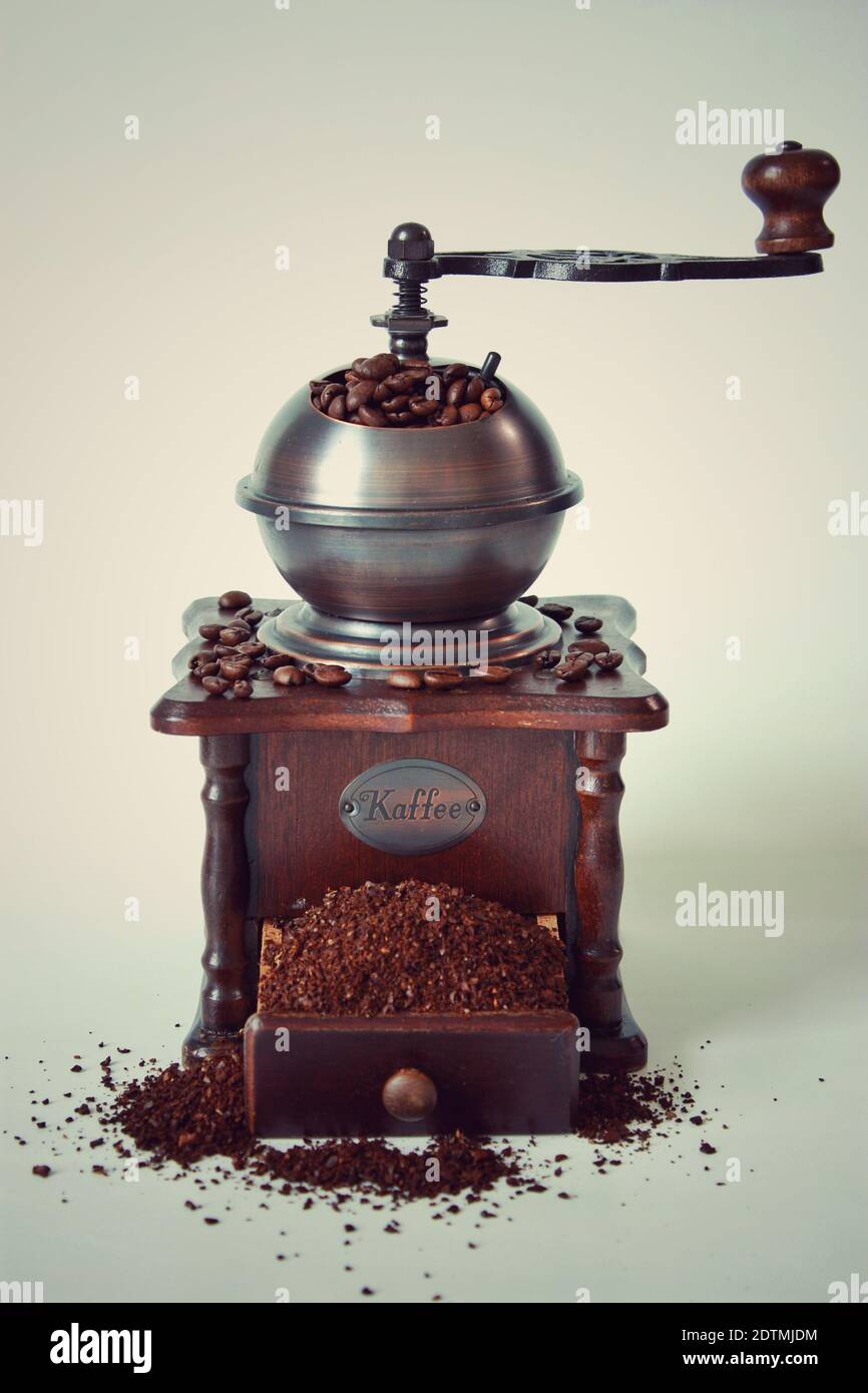 Vintage coffee bean grinder full of beans Stock Photo Alamy