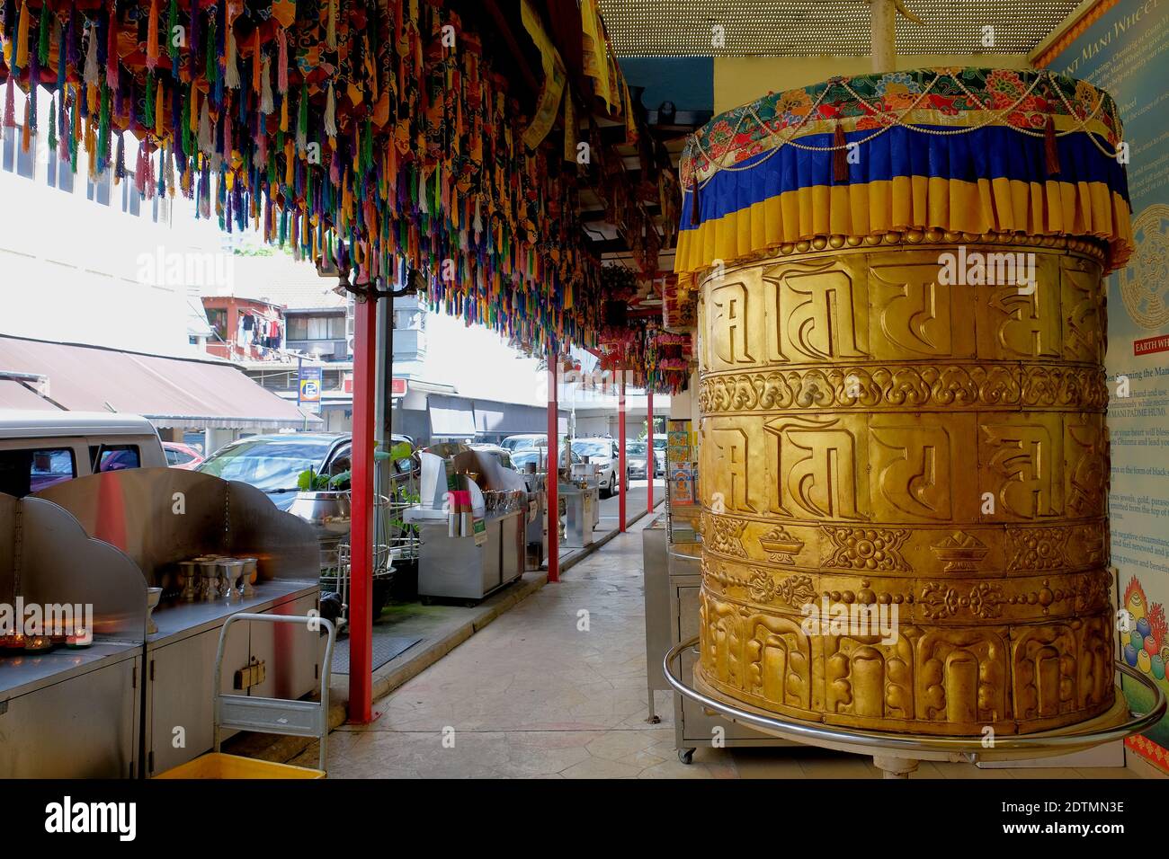 Large Prayer - Mani Wheel at Thekchen Choling, a small Tibetan Buddhist temple located at Beatty Road in the Jalan Besar enclave, Singapore Stock Photo