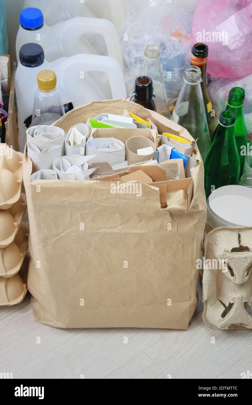 Cardboard and paper prepared for recycling. Bundles of cardboard to be