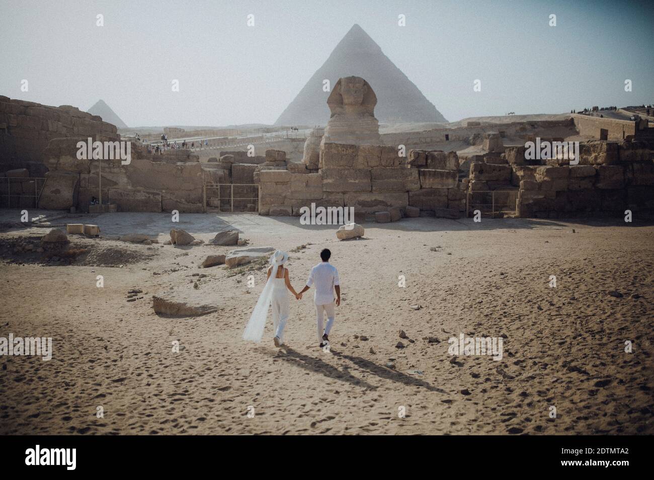 Couple in the Pyramids, Giza, Cairo, Egypt Stock Photo