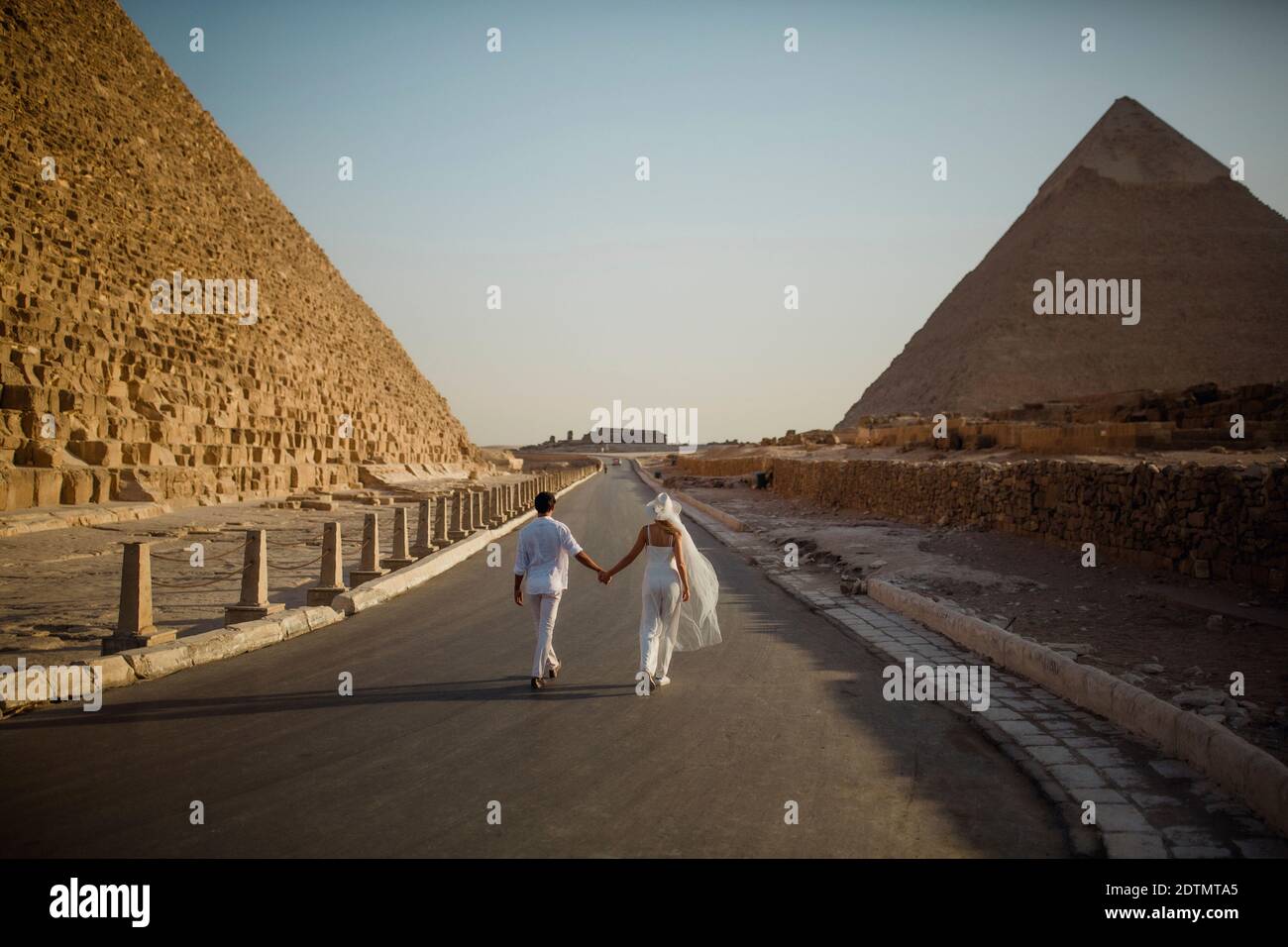 Couple in the Pyramids, Giza, Cairo, Egypt Stock Photo