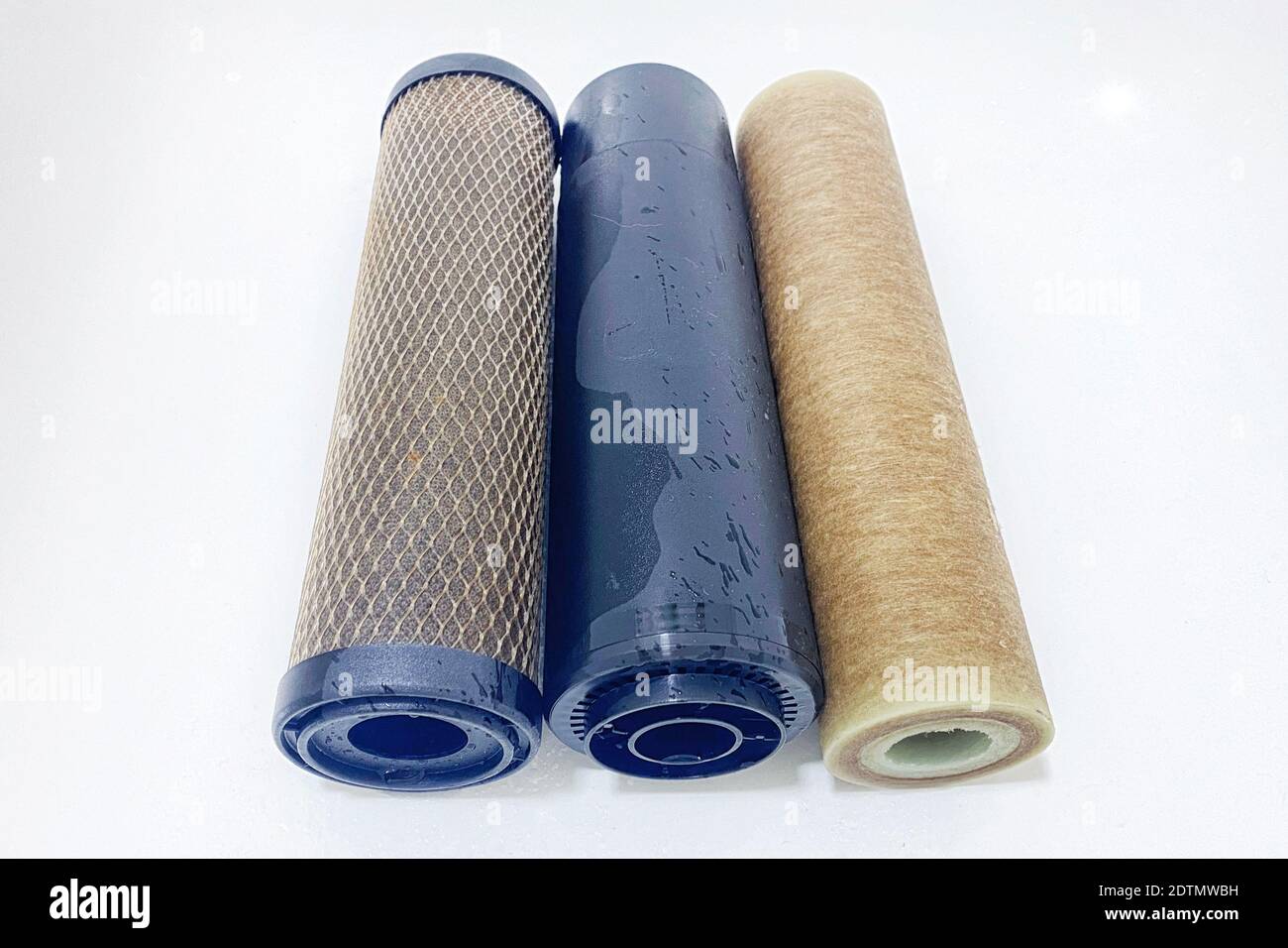 Used water filter cartridges, closeup. Elements of a filtration system for clean and healthy water. Stock Photo