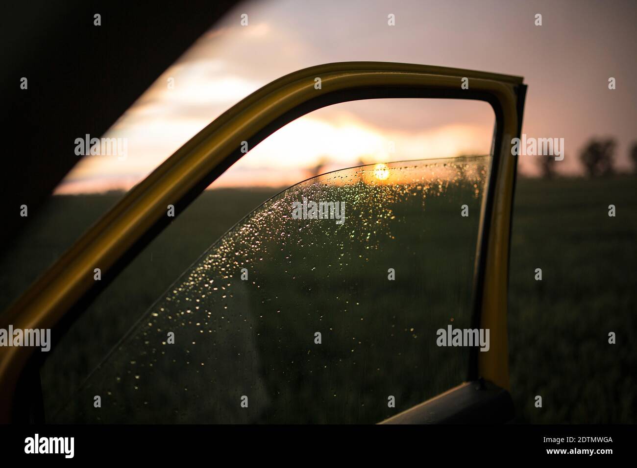 View through a lowered car window onto the landscape after a thunderstorm Stock Photo