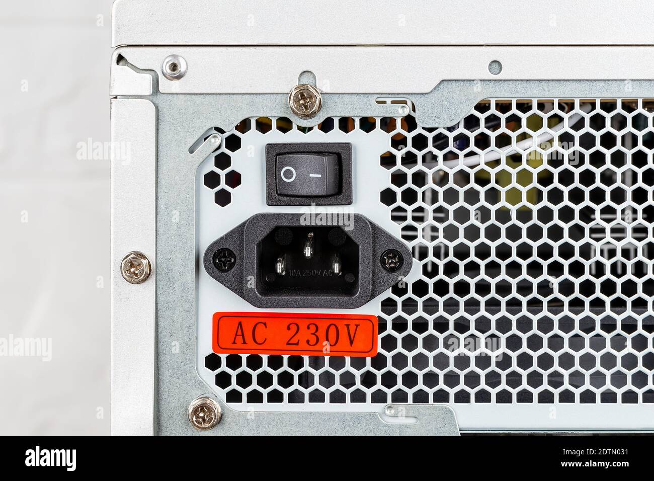 Rear view of tower computer case with new power supply unit installed