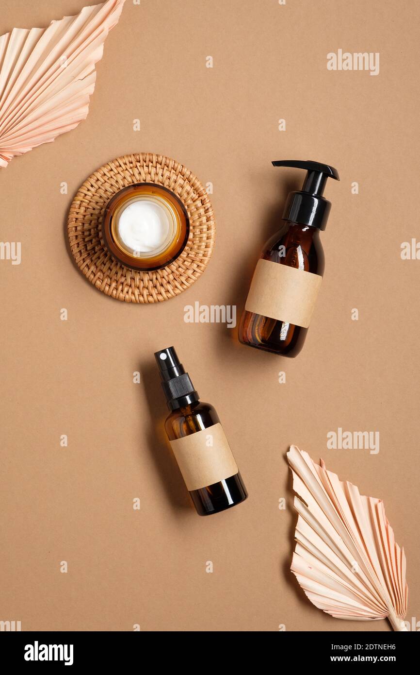 Download Natural Cosmetics Packaging Design Amber Glass Bottle With Empty Label Spray Bottle Jar Of Moisturizer Cream On Brown Background Flat Lay Top Vie Stock Photo Alamy