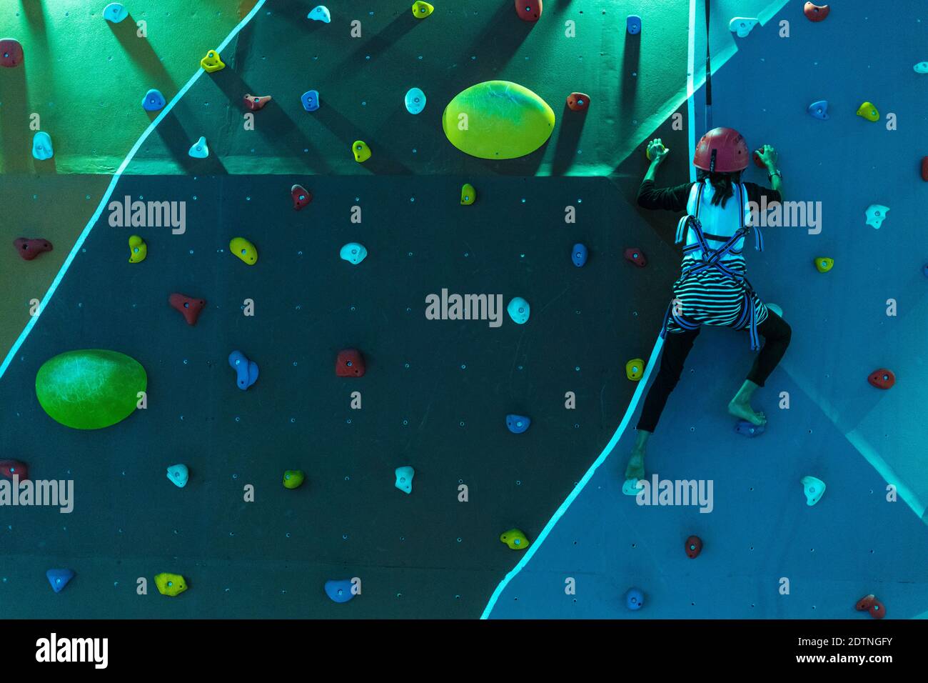 Girl climbing a wall Stock Photo Alamy