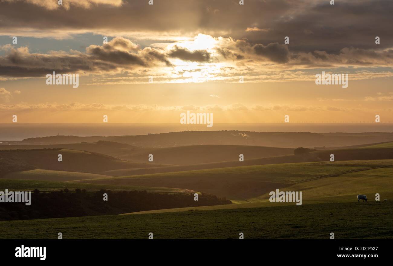 Sunset viewed from the South Downs at Firle Beacon, East Sussex, UK Stock Photo