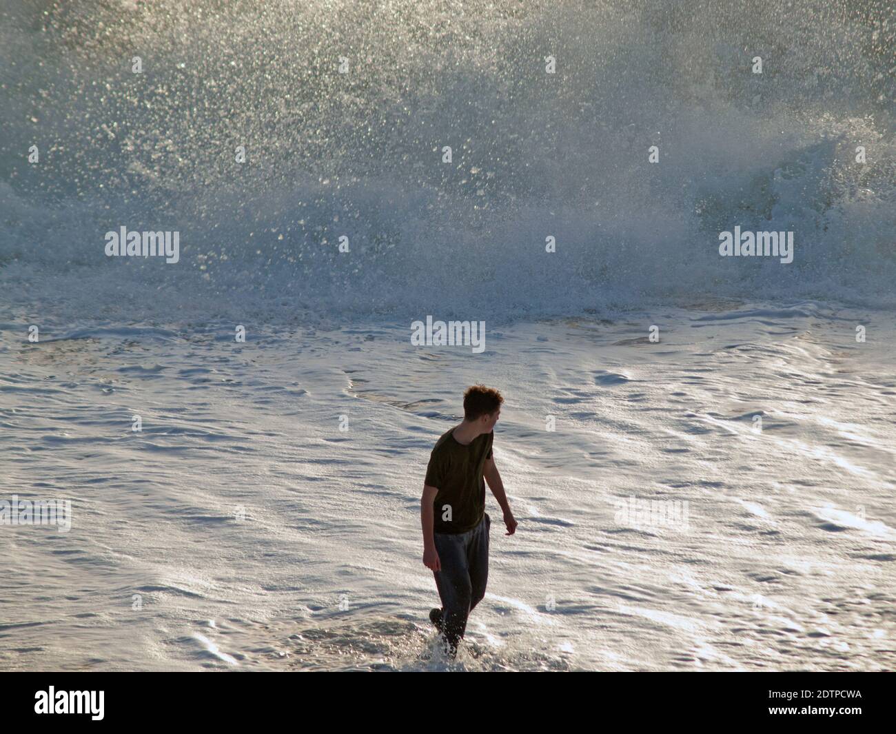 Boy paddling in sea hi-res stock photography and images - Alamy