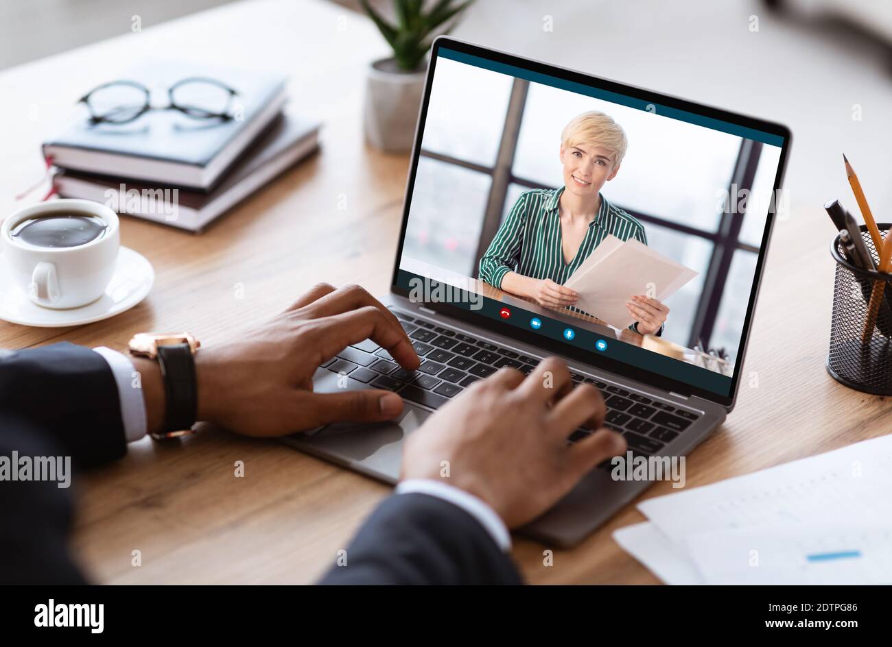 Unrecognizable black businessman having videocall with business partner, using laptop Stock Photo