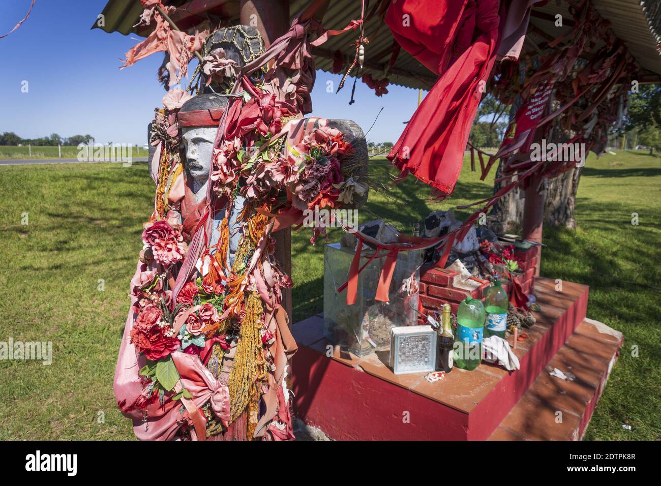 FIRMAT, ARGENTINA - Dec 21, 2020: A shrine in honor of Gauchito Gil, the most prominent folk religious figure,  in the outskirts of Firmat, Santa Fe, Stock Photo