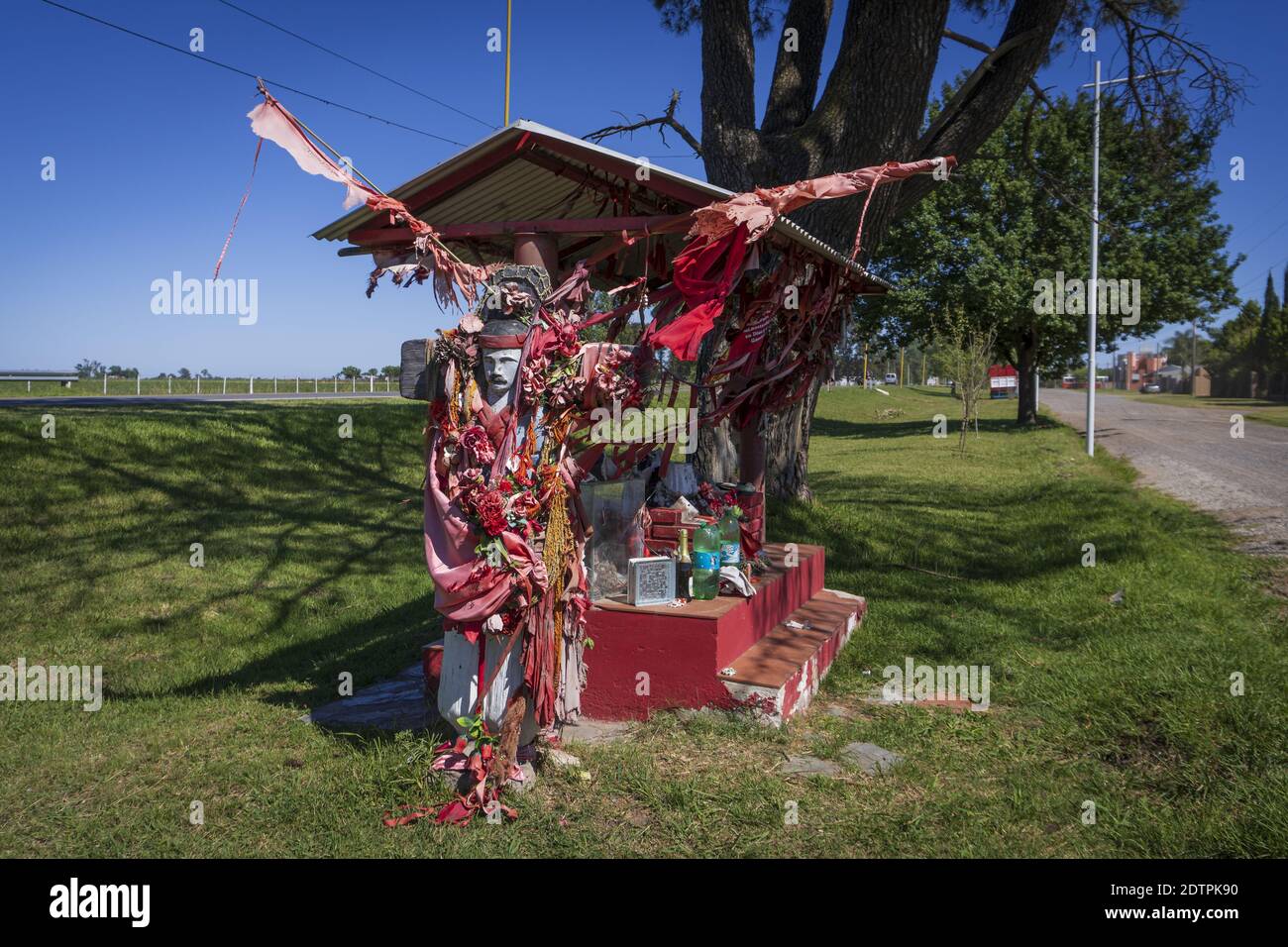 FIRMAT, ARGENTINA - Dec 21, 2020: A shrine in honor of Gauchito Gil, the most prominent folk religious figure,  in the outskirts of Firmat, Santa Fe, Stock Photo