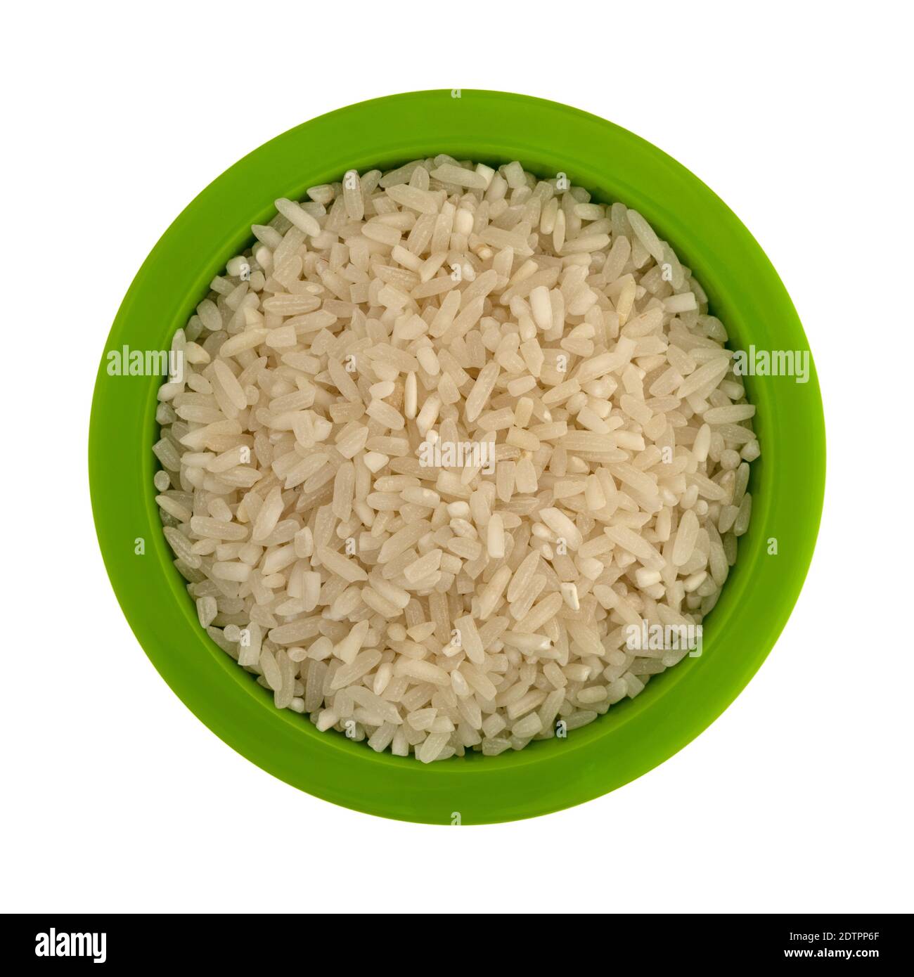 Top view of enriched long grain rice in a small green bowl isolated on a white background. Stock Photo