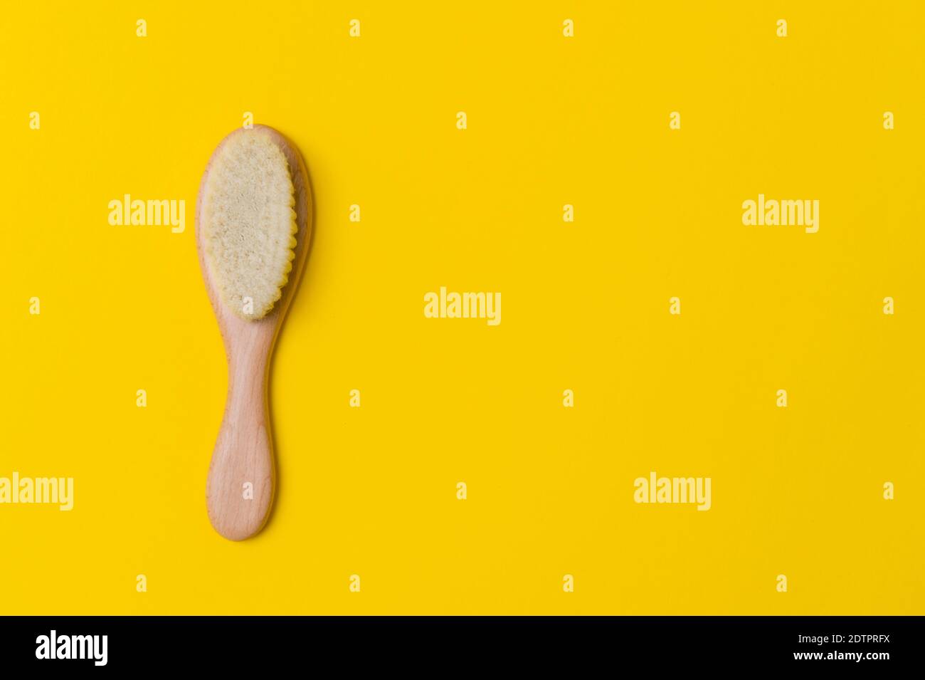 Natural soft goat bristle hair sweeping brush men beard on yellow background. Top view, space for your text Stock Photo
