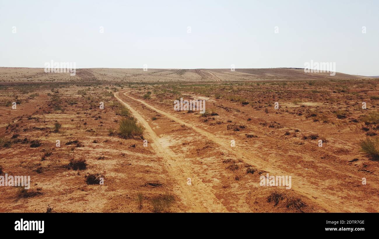 Scenic View Of Arid Landscape Against Clear Sky Stock Photo