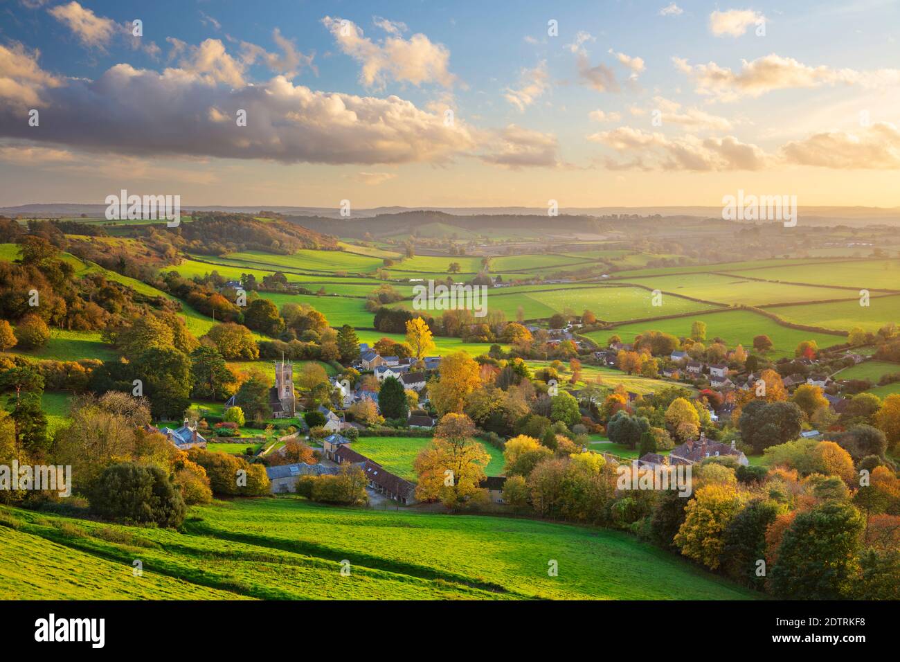 View in autumn over the village of Corton Denham and countryside at sunset, Corton Denham, Somerset, England, United Kingdom, Europe Stock Photo