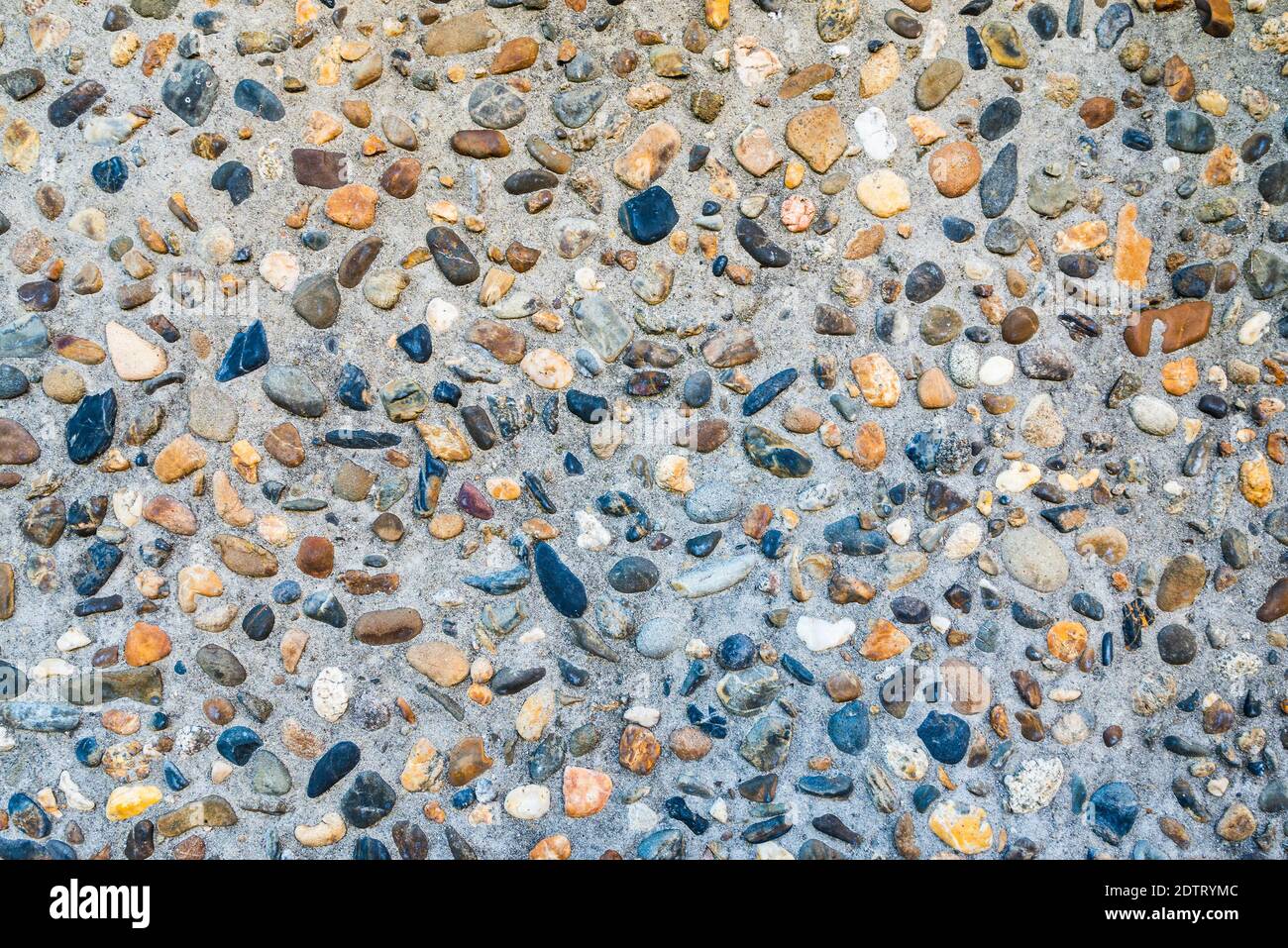 Small pebble and cement floor background Stock Photo