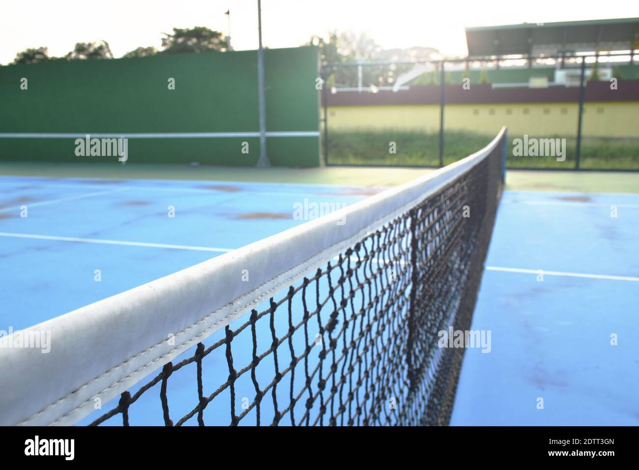 net of tennis court with white border line on blue floor Stock Photo