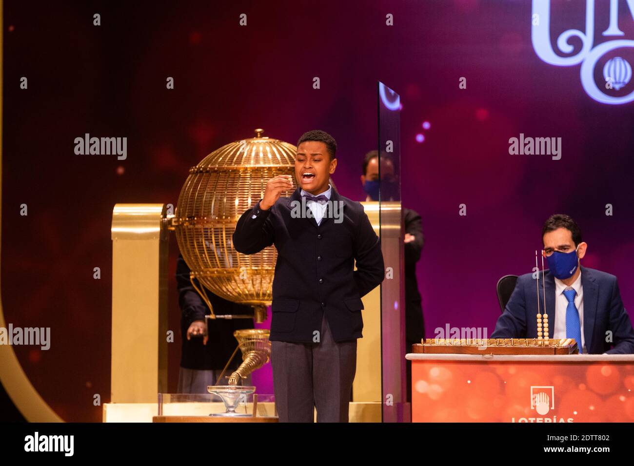 Madrid, Spain. 22 December, 2020: Pupils of the San Ildefonso school, hold the ball bearing of the fourth prize number during the draw of Spain's Christmas lottery named 'El Gordo' (Fat One) at the Teatro Real on December 22, 2020 in Madrid, Spain. The fourth prize number is 52472, with a total of 200.000 euros for the prize to be shared between ten ticket holders. Credit: Jon Imanol Reino/Alfa Images/Alamy Live News Stock Photo