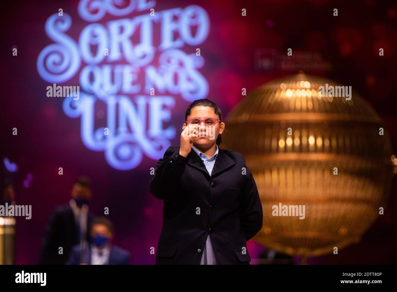 Madrid, Spain. 22 December, 2020: Pupils of the San Ildefonso school, hold the ball bearing of the third prize number during the draw of Spain's Christmas lottery named 'El Gordo' (Fat One) at the Teatro Real on December 22, 2020 in Madrid, Spain. The third prize number is 52472, with a total of 500.000 euros for the prize to be shared between ten ticket holders. Credit: Jon Imanol Reino/Alfa Images/Alamy Live News Stock Photo