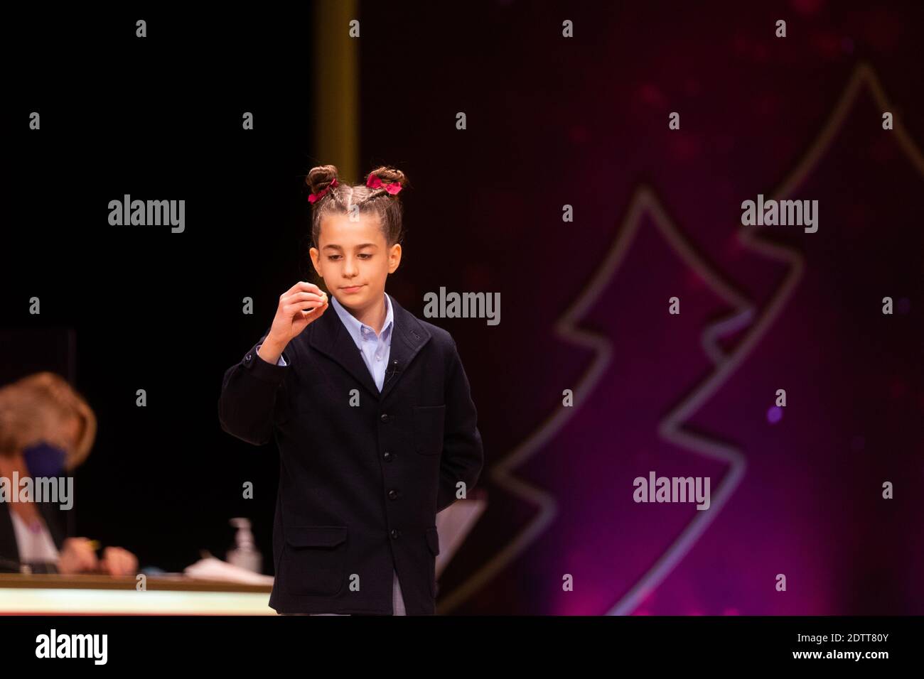 Madrid, Spain. 22 December, 2020: Pupils of the San Ildefonso school, hold the ball bearing of the third prize number during the draw of Spain's Christmas lottery named 'El Gordo' (Fat One) at the Teatro Real on December 22, 2020 in Madrid, Spain. The third prize number is 52472, with a total of 500.000 euros for the prize to be shared between ten ticket holders. Credit: Jon Imanol Reino/Alfa Images /Alamy Live News Stock Photo