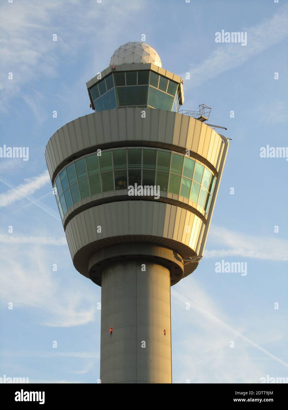 A vertical shot of air traffic control tower in Amsterdam Schiphol ...