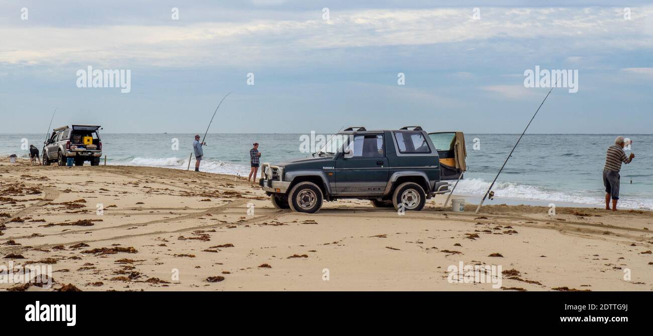 Fishers beach fishing with fishing rods at Guilderton Western Australia Stock Photo