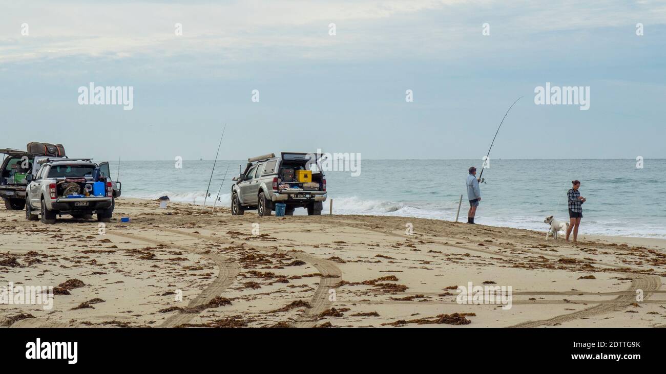 Fishers beach fishing with fishing rods at Guilderton Western Australia Stock Photo