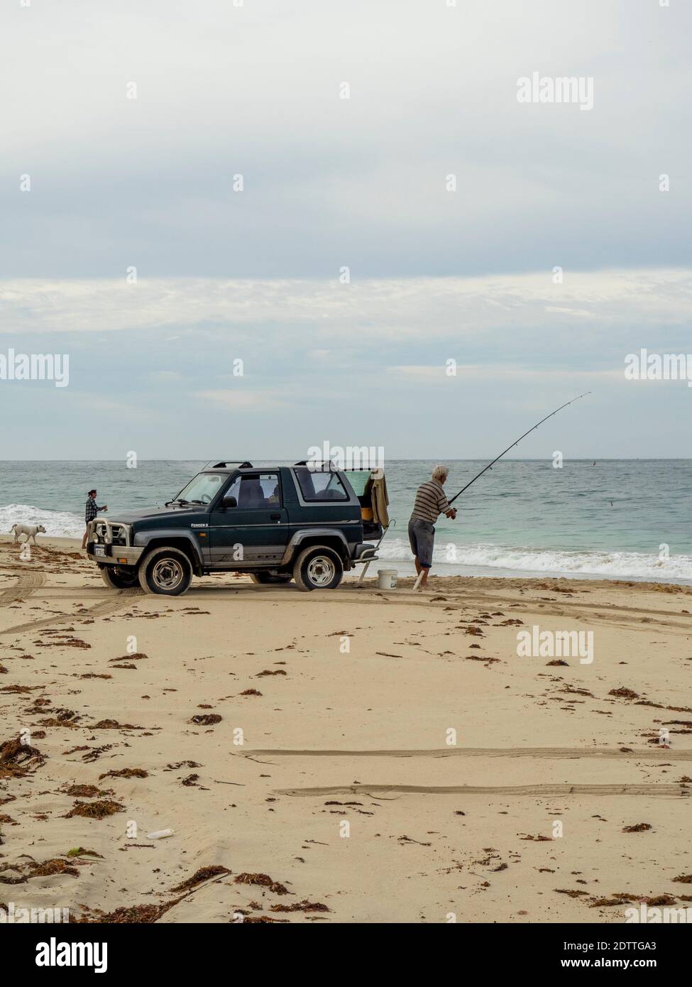 Fishers beach fishing with fishing rods at Guilderton Western Australia Stock Photo