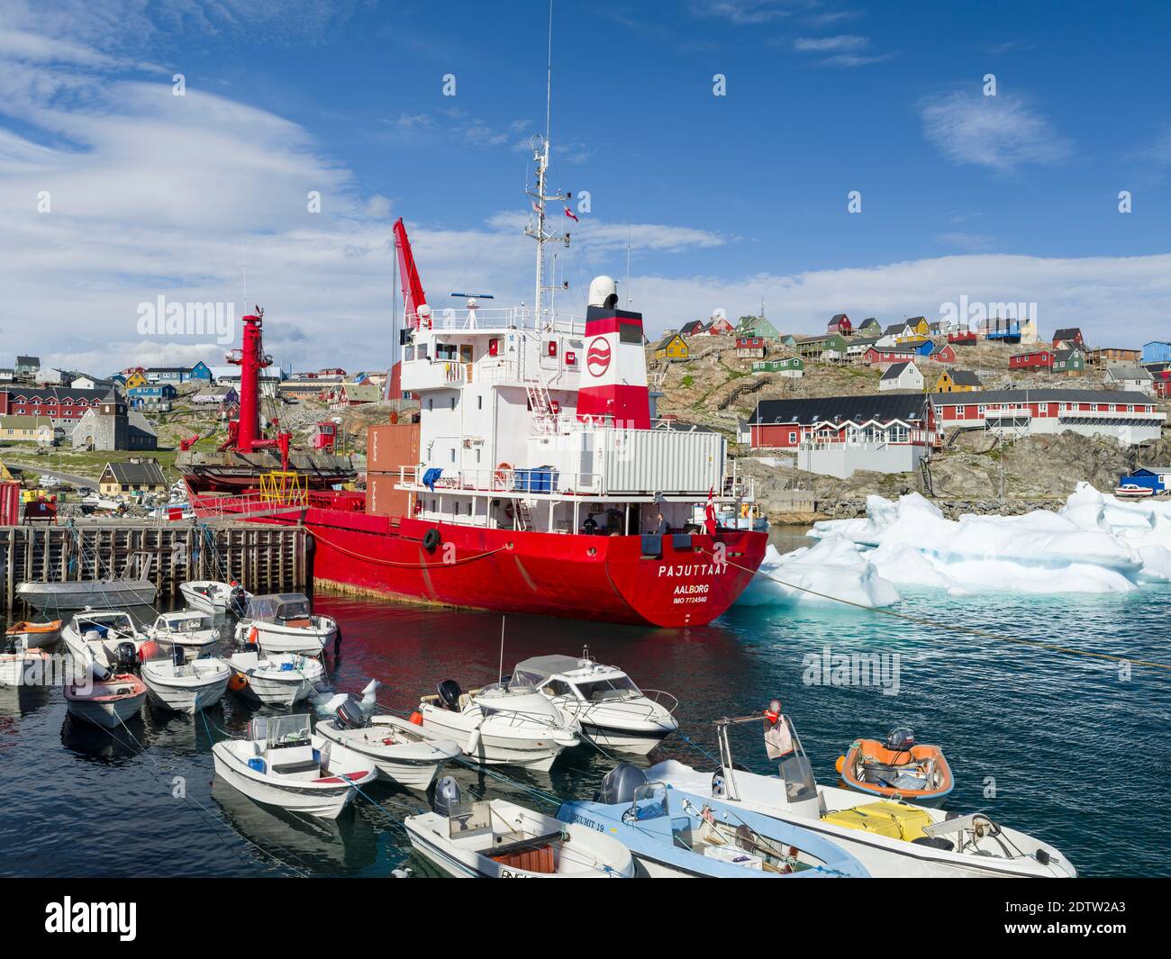The harbour with the supply vessel.  The town Uummannaq in the north of West Greenland, located on an island  in the Uummannaq Fjord System. America, Stock Photo