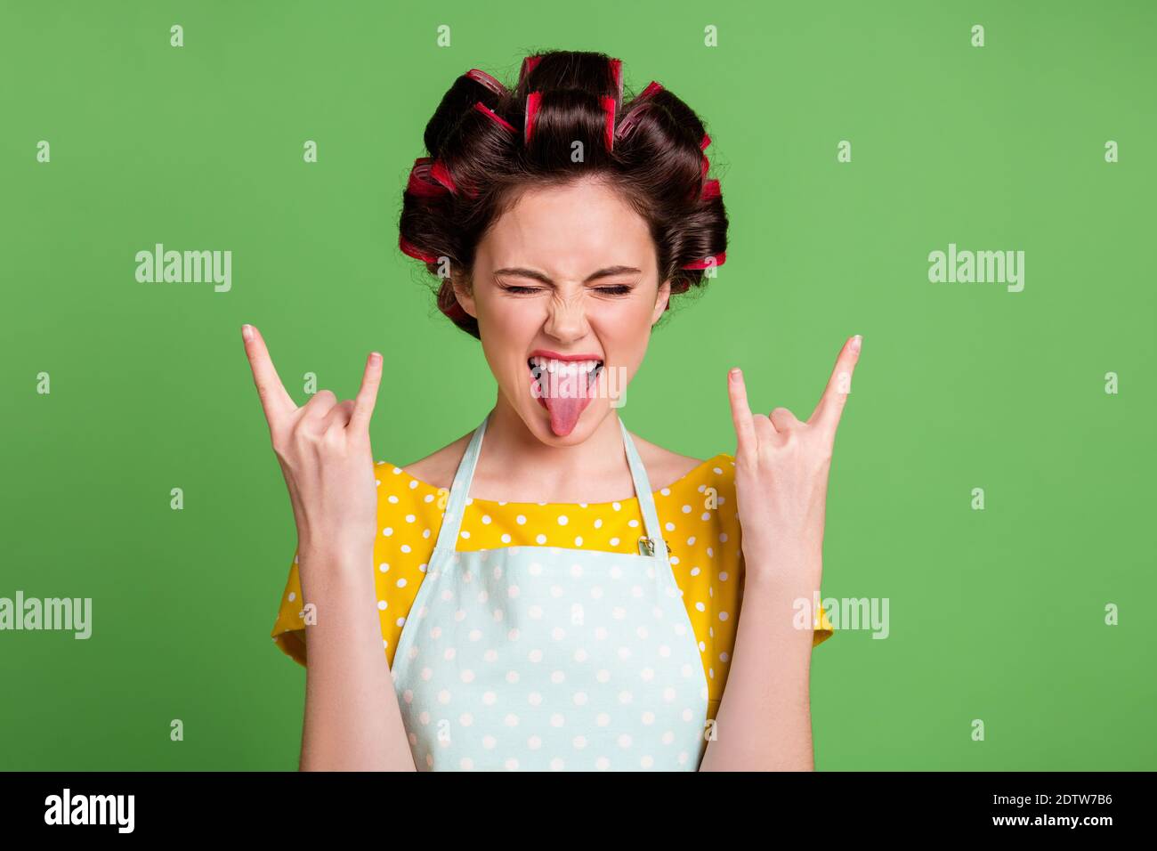 Close-up portrait of her she nice attractive cool naughty glamorous cheerful cheery crazy maid wearing curlers showing double horn symbol grimacing Stock Photo