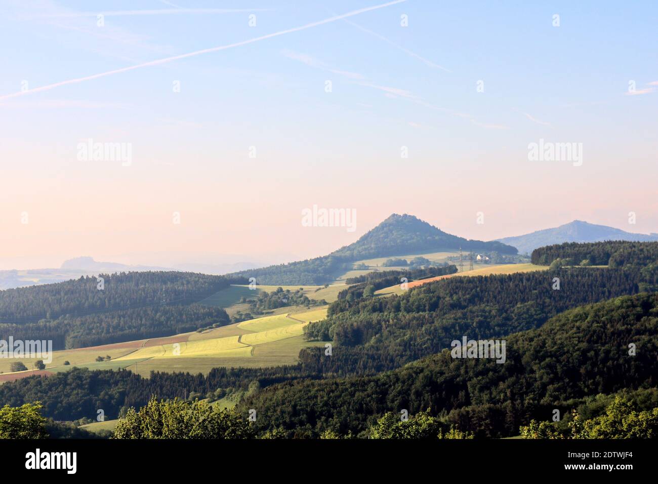 Scenic View Of Landscape And Mountains Against Sky Stock Photo