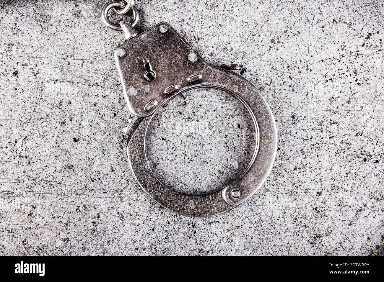Handcuff on the Grunge Metal Background closeup Stock Photo Alamy