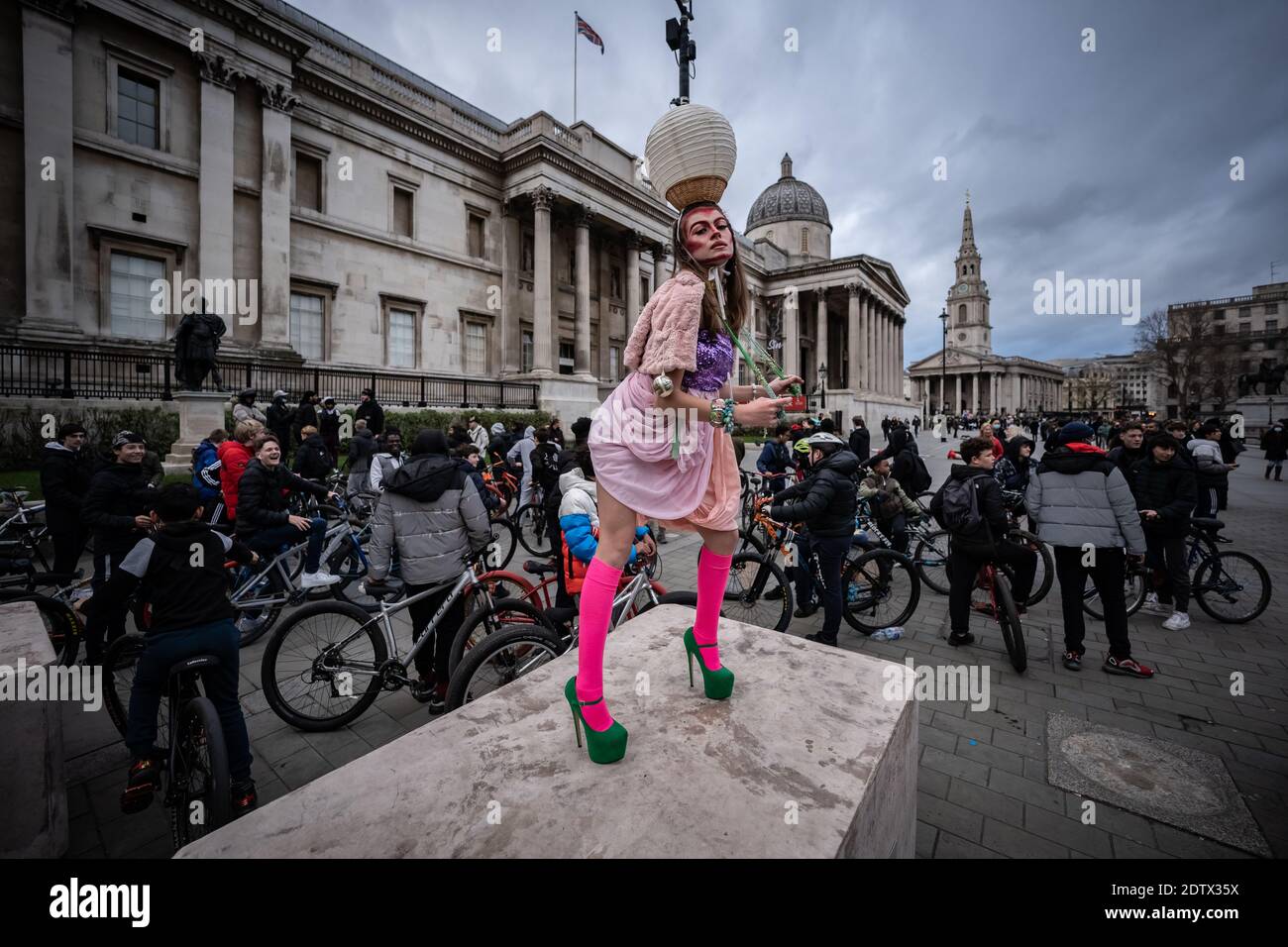 Models take part in a colourful flashmob street fashion show near Trafalgar Square for designer Pierre Garroudi. London, UK. Stock Photo