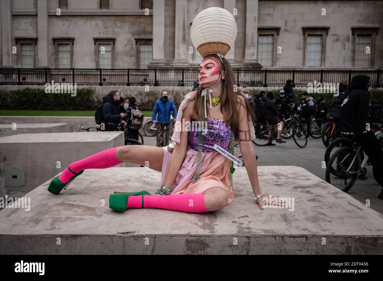 Models take part in a colourful flashmob street fashion show near Trafalgar Square for designer Pierre Garroudi. London, UK. Stock Photo