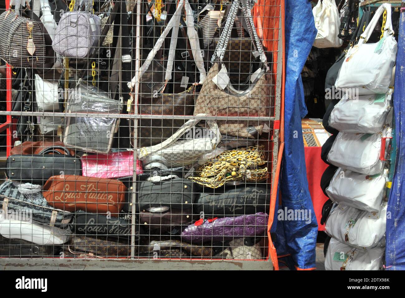falce Louis Vuitton woman handbags before a shop, Chinatown district, Kuala Lumpur, Malaysia Stock Photo
