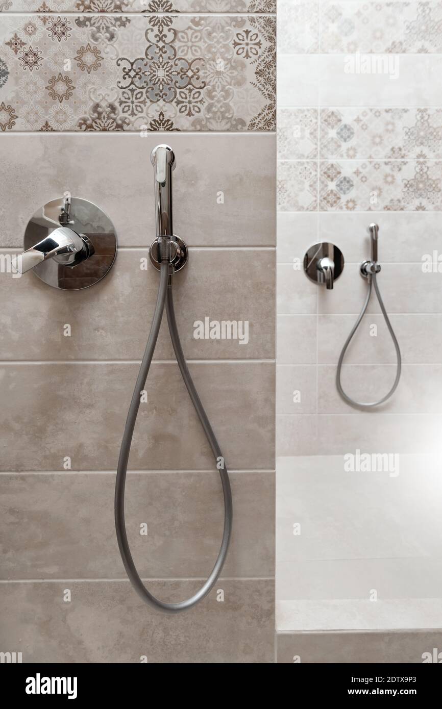 Hygienic shower and faucet built into the wall Stock Photo Alamy