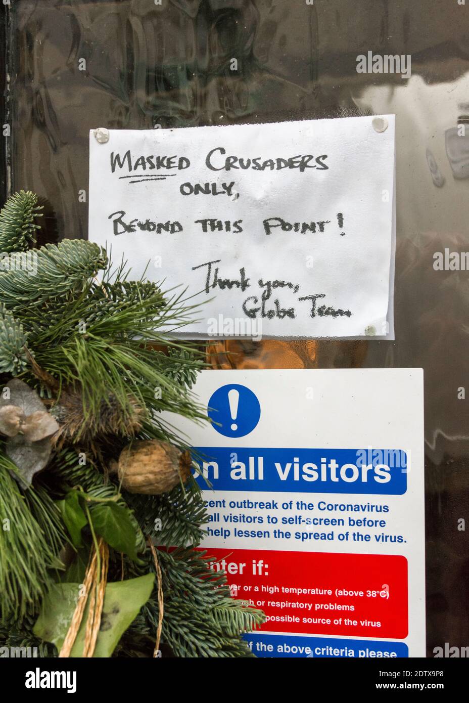 Safety rules sign for Pub customers in UK post-Covid lockdown. Sign on front door of Globe Inn, Lostwithiel, warning of their Covid rule routine. Stock Photo