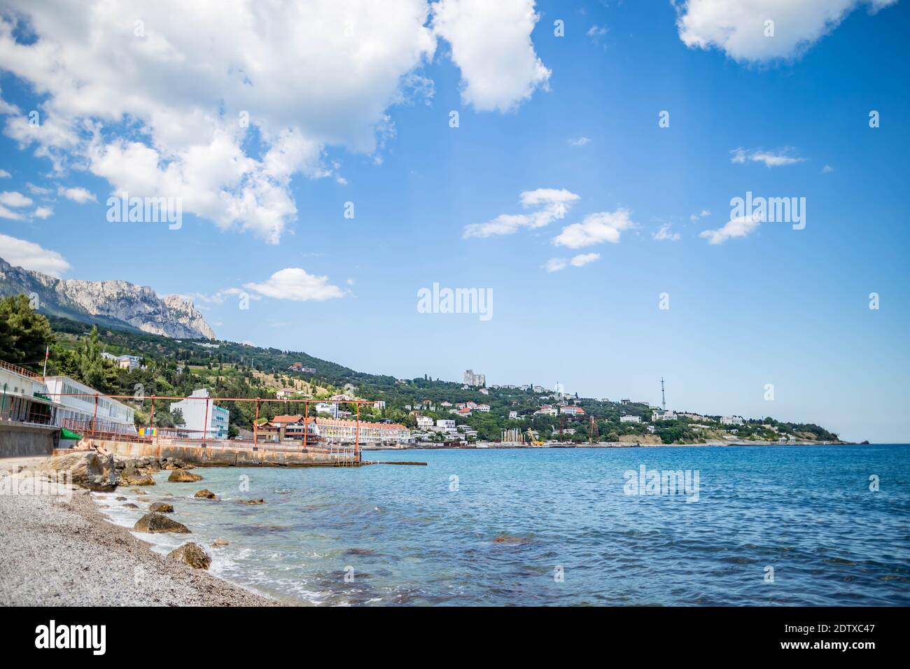Scenic View Of Sea By Buildings Against Sky Stock Photo