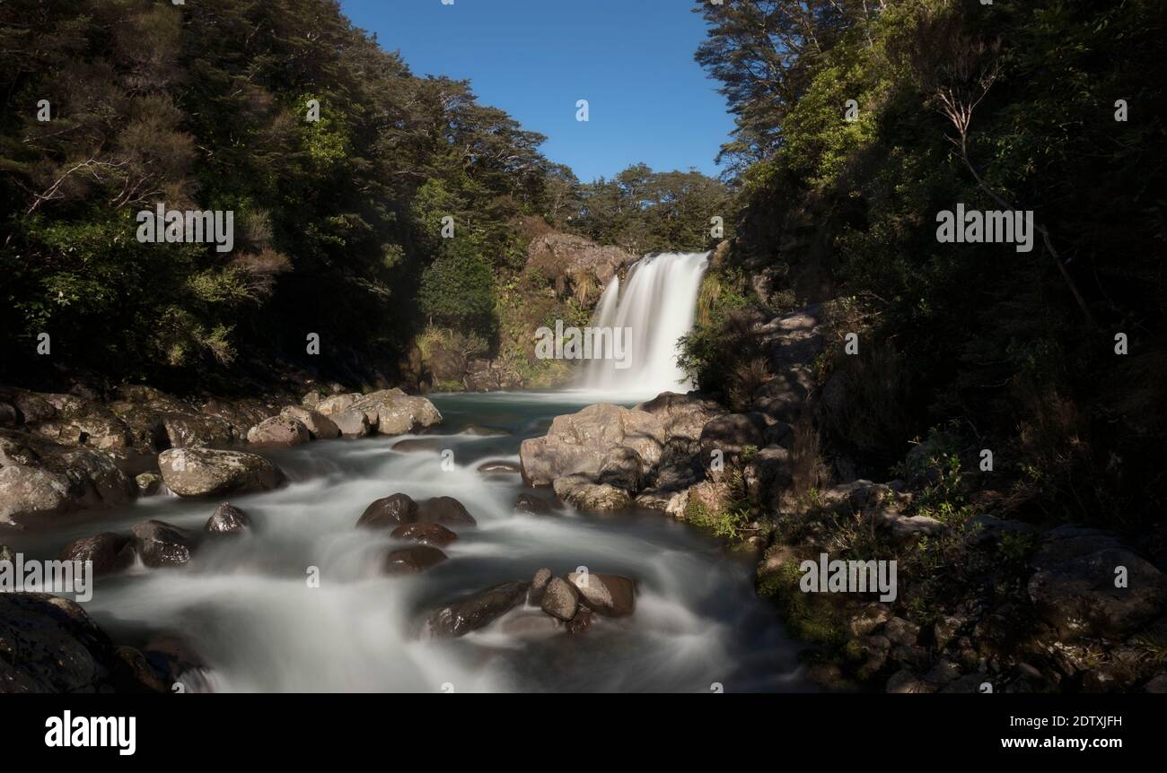 A long exposure of a beautiful powerful waterfall the the Tongariro National park in New Zealand showing the power and the peacefulness of nature. Stock Photo